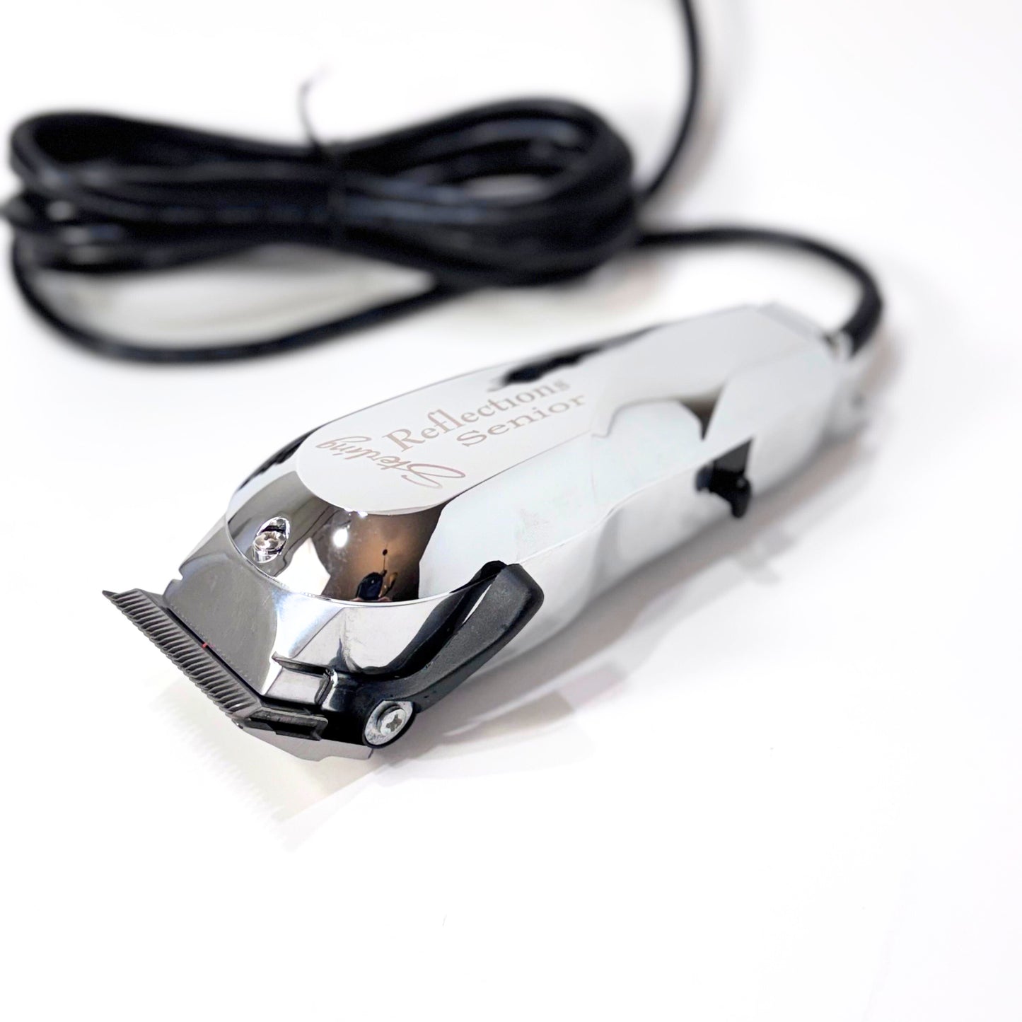 Wahl Reflections senior silver clipper laying flat left angle