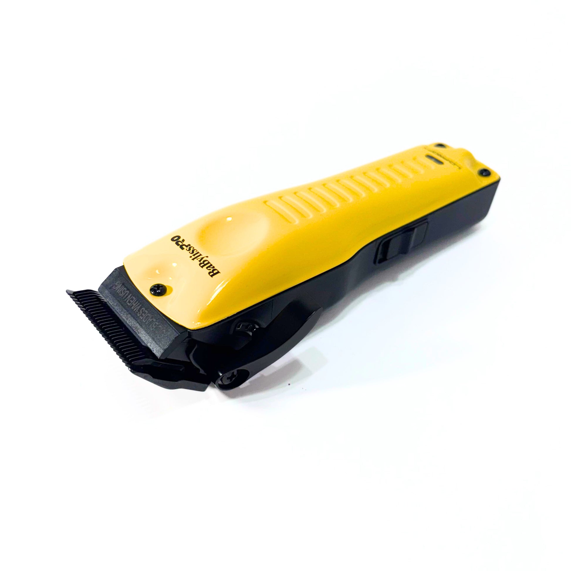 BaBylissPRO Yellow LO-PROFX Cordless Clipper FX825YI with Brushless Motor lying on angle