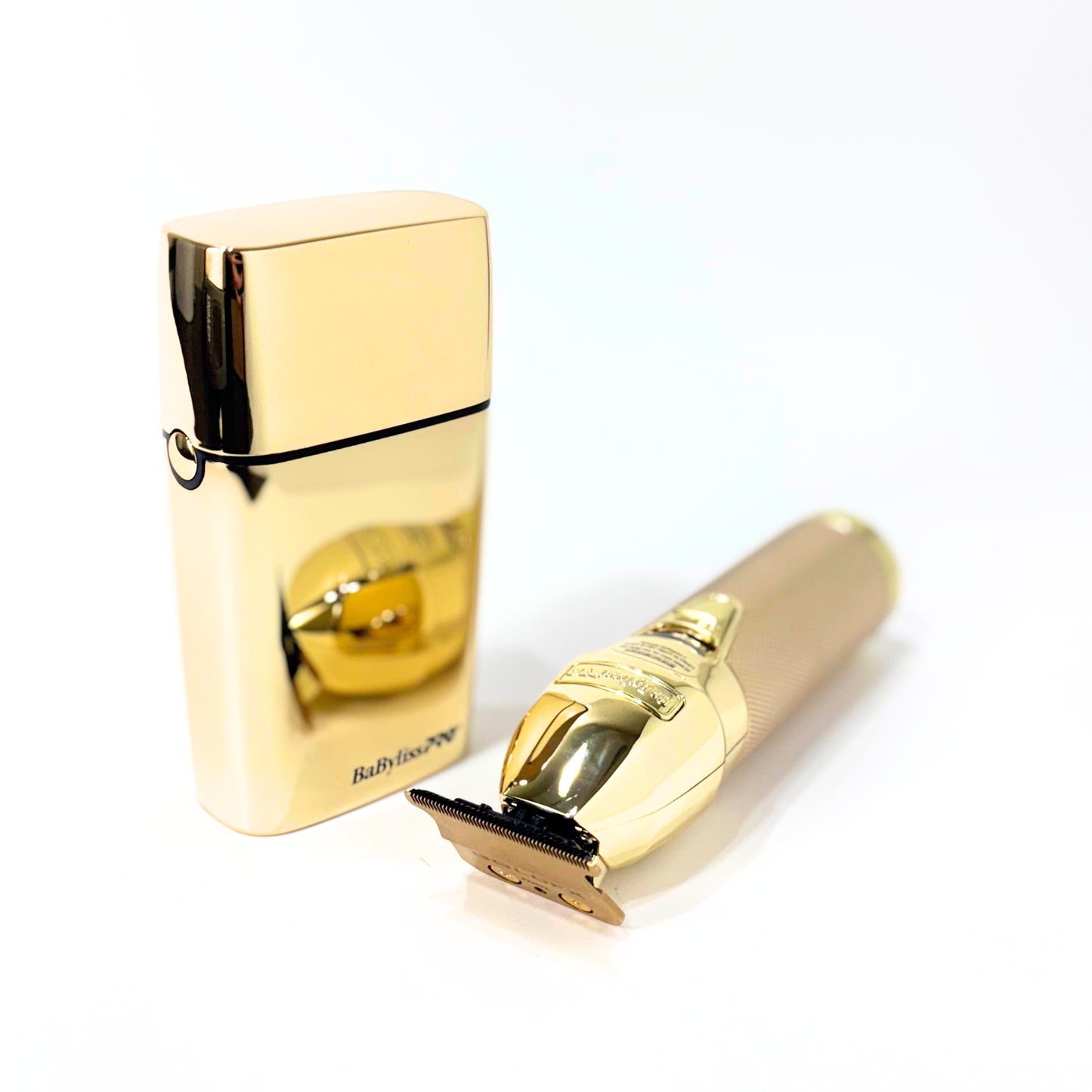 babylisspro goldfx trimmer and double foil shaver combo trimmer laying next to shaver